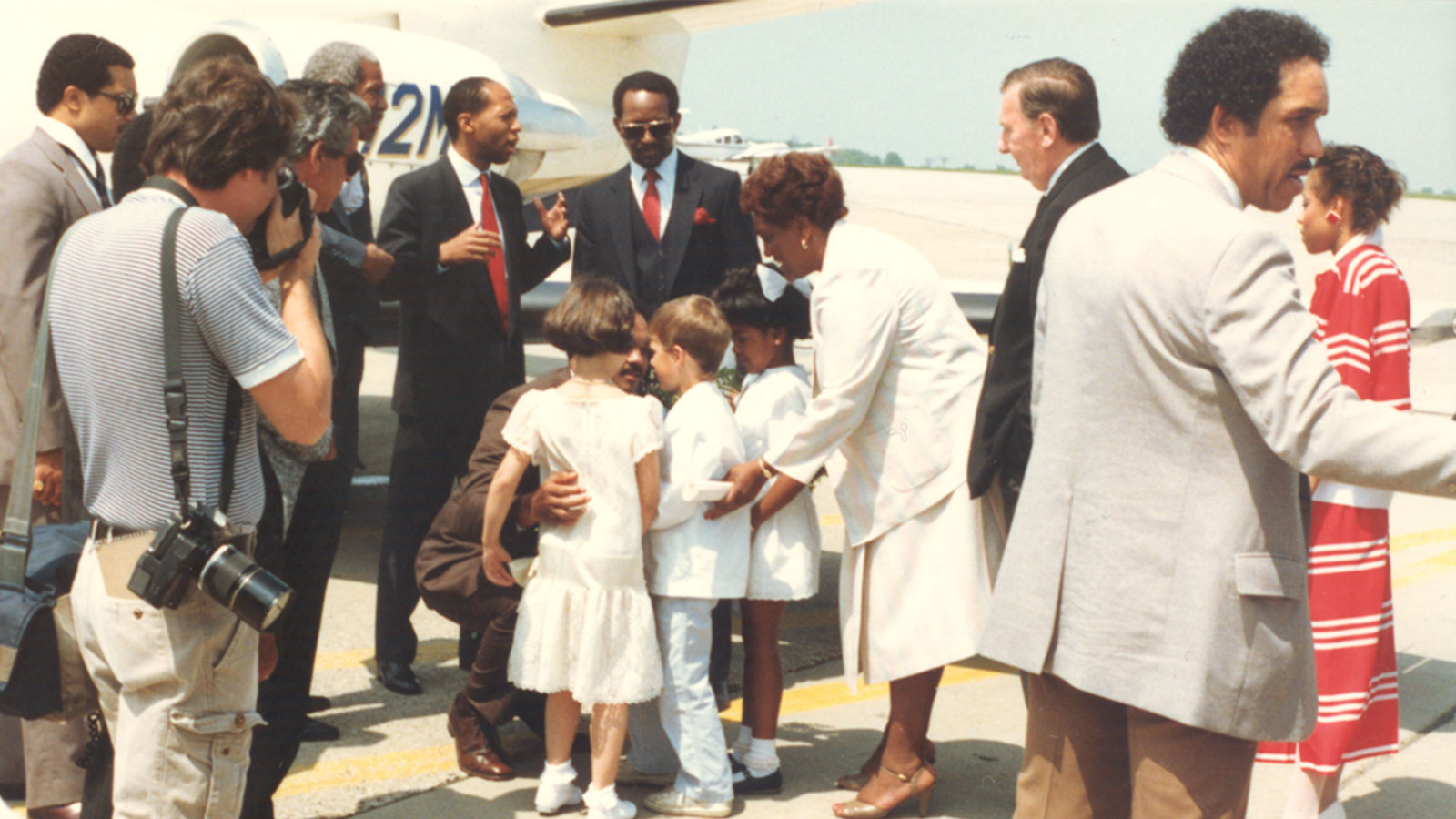 Children greeting Rev. Jesse L. Jackson at Youngstown Municipal Airport during his arrival event.
