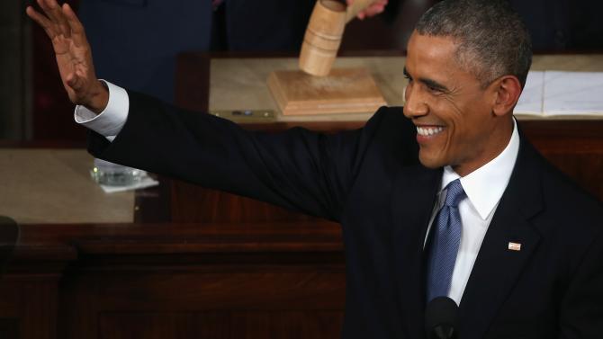 461853410-president-barack-obama-waves-before-giving-the-state-of