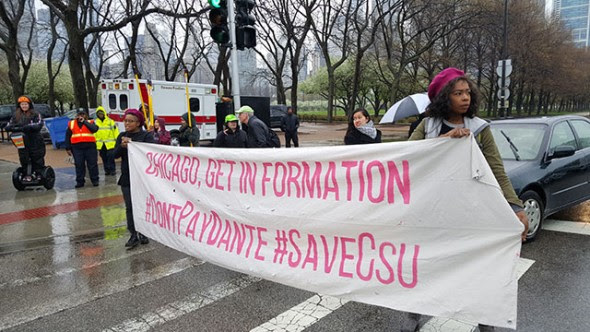 Lanes of traffic that were not blocked by chained protesters were shut down by banners bearing the group's messaging. (Photo: Kelly Hayes)