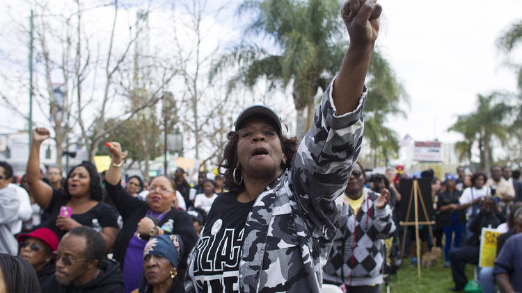 Linda Jay, wearing a Black Lives Matter shirt, joins hundreds of protesters