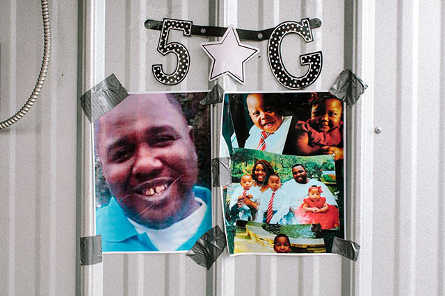 Photos of Alton Sterling outside the Triple S Food Mart, where he was shot and killed by police early Tuesday, in Baton Rouge, Louisiana, on July 6, 2016. The Justice Department opened a civil rights investigation Wednesday into the fatal shooting of Sterling, a black man, by the Baton Rouge police that was captured on video. (William Widmer / The New York Times)