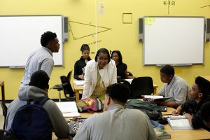 Tonya Ray, center, a math teacher at the Academy of Public Leadership, talking with students in Detroit, May 11, 2016.  (Joshua Lott / The New York Times)