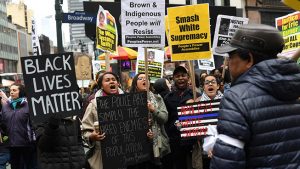 Activists attend a Black Lives Matter protest in Manhattan against President Donald Trump and New York Mayor Bill de Blasio on April 1