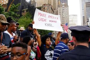 Standing with Colin Kaepernick - Photo By Bud Korotzer