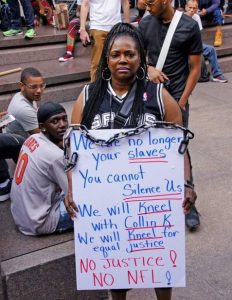 Standing with Colin Kaepernick - Photo By Bud Korotzer