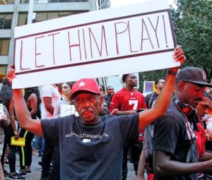 Standing with Colin Kaepernick - Photo By Bud Korotzer