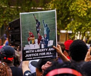 Standing with Colin Kaepernick - Photo By Bud Korotzer