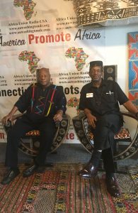 Dr. Molefi Asante and Dr. Ron Daniels enjoy a moment together on African Stools in the Media Center of the African Union Headquarters in Washington, D.C. They were both speakers for the Constituency for Africa's Annual Ron Brown Series. Mel Foote is the President/CEO.