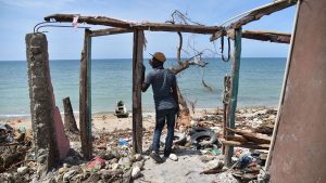 Man stands in a ruined building after Hurricane Matthew hit Haiti. (photo: CNN)