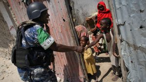 African Union Mission in Somalia (AMISOM) soldier greets a group of children during a patrol in the Kaa’ran district of Somali capital, Mogadishu.