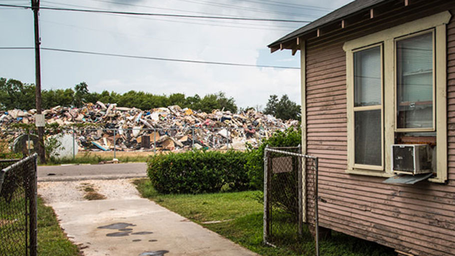 Home across the street from a temporary dumpsite on 19th Street in Port Arthur, Texas.