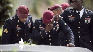 Members of the 3rd Special Forces Group, 2nd battalion cry at the tomb of US Army Sgt. La David Johnson at his burial service in the Memorial Gardens East cemetery on October 21, 2017, in Hollywood, Florida. Sgt. Johnson and three other US soldiers were killed in an ambush in Niger on October 4, 2017.