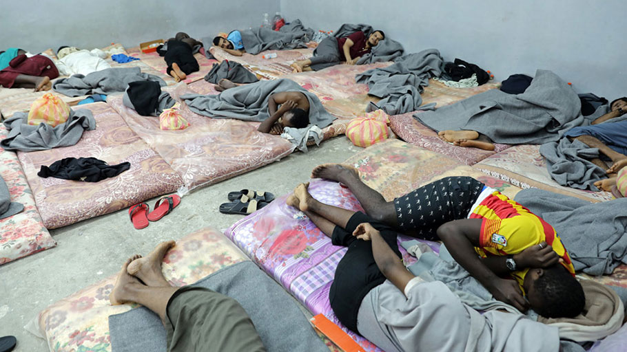 In Libya, dozens of migrants sleep alongside one another in a cramped cell in Tripoli's Tariq al-Sikka detention facility.