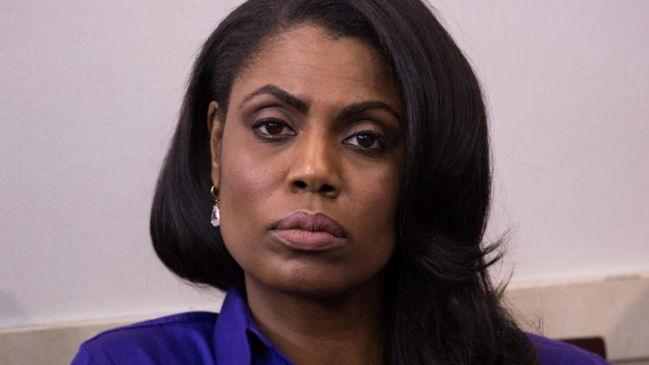 Omarosa Manigault Newman stares into camera as Black photographer Cheriss May takes photo early in the Trump administration