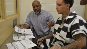 Glasgow Helps Collin Bennett Register to Vote Inside the Dothan City Jail