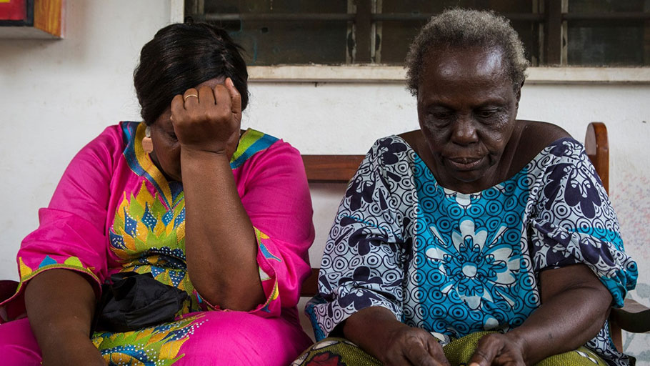 Martine de Souza, 52, left, a descendant of Francisco Félix de Souza, sits with her mother, Dagba Eulalie, 70, at their home in Ouidah in January. Eulalie is descended from a slave who was brought to Ouidah from what is now Nigeria in the late 1800s, and married off to a resident of the city.