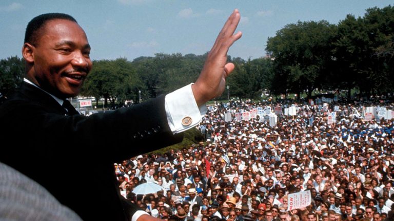 dr-martin-luther-king-waving-at-rally - Institute of the Black World ...