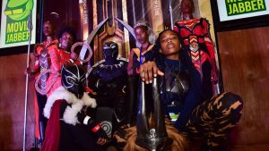 Cosplayers portraying characters from the 2018 US superhero film based on the Marvel Comics character, Black Panther, pose in the Kenyan capital, Nairobi on February 14, 2018