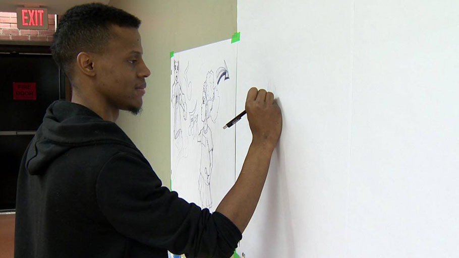Artist Othell Downey drew different scenes of an event to create a book in a day that was held at Halifax North Memorial Public Library on Feb. 24, 2018.