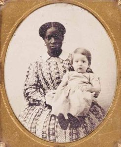 Lucy Cottrell, who was enslaved at Monticello, was purchased at Thomas Jefferson’s estate sale by UVA professor George Blaettermann; pictured here holding Blaettermann’s daughter, circa 1835