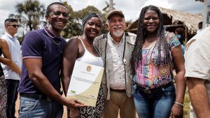 Villagers with the land title deed