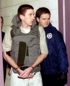 Oklahoma City bomber Timothy McVeigh is escorted from jail in 1996. McVeigh wanted to ignite a race war and wrest the American economy from a conspiracy to replace factory jobs with “pink collar” work.