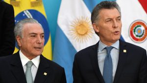 Brazilian president Michel Temer (L) and Argentine President Mauricio Macri arrive to pose for the official picture at the end of the Mercosur Summit in mendoza, 1080 km west of buenos Aires on July 21, 201