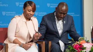 Lezley McSpadden, mother of Michael Brown, prays with Benjamin Crump, attorney for the families of Brown, Trayvon Martin, and Stephon Clark, at the IOP's forum on the Black Lives Matter movement four years after Brown's slaying.