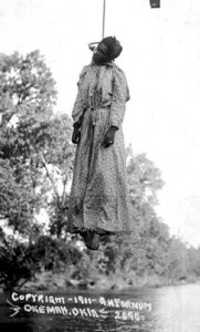 Lynching of Laura Nelson, May 1911, Okemah, Oklahoma, presented as a photo postcard. Stamp on reverse reads ‘unmailable’. Photograph: George Henry Farnum/1911