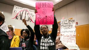 Students protest a speech by author Charles Murray, who co-wrote a book discussing racial differences in intelligence, at the University of Michigan in Ann Arbor on October 11, 2017