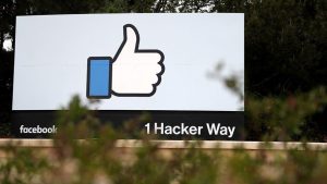 A sign outside Facebook headquarters in Menlo Park, California, during an April 5, 2018 demonstration staged by activist group 'Raging Grannies'