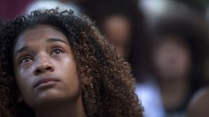 A protester cries during a March 20 demonstration against the killing of Marielle Franco in front of the Municipal Chamber of Rio de Janeiro.