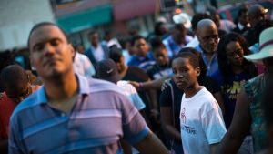 A young boy stands at a Black Lives Matter prayer vigil on the steps of the First Baptist Church, a predominantly African-American congregation, in Macon, Georgia