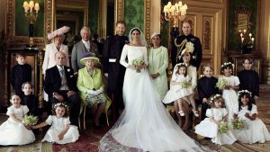 An official wedding photo of Britain's Prince Harry and Meghan Markle, center, in Windsor Castle, Windsor, England, Saturday May 19, 2018. Others in photo from left, back row, Jasper Dyer, Camilla, Duchess of Cornwall, Prince Charles, Doria Ragland, Prince William; center row, Brian Mulroney, Prince Philip, Queen Elizabeth II, Kate, Duchess of Cambridge, Princess Charlotte, Prince George, Rylan Litt, John Mulroney; front row, Ivy Mulroney, Florence van Cutsem, Zalie Warren, Remi Litt.