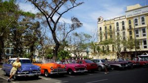 A vintage car driver waits for tourists after Hurricane Irma caused flooding and a blackout, in Havana, Cuba September 12, 2017