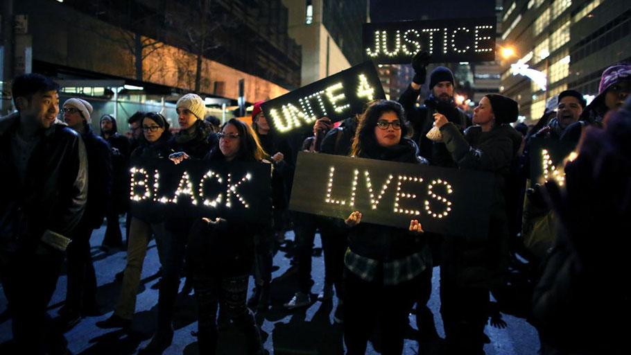 Marchers approach the West Side Highway during a protest, in New York, on December 4, 2014. Protests began after a Grand Jury decided to not indict NYPD Officer Daniel Pantaleo. Eric Garner died after being put in a chokehold by Pantaleo on July 17, 2014. YANA PASKOVA/GETTY