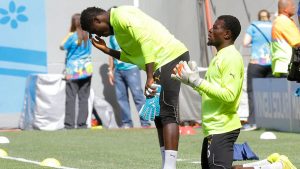 Ghana’s goalkeepers, Stephen Adams (L) and Fatawu Dauda (R), pray before a 2014 World Cup match. Robert Ghement/EPA