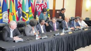 Jamaica's Prime Minister Andrew Holness (fourth left) strikes up a conversation with (from left) St Lucia's Prime Minister Allan Chastinet, Barbados' Prime Minister Mia Mottley and Grenada's Prime Minister Dr Keith Mitchell before the start of Friday night's press conference. (Photo: Anthony Lewis)