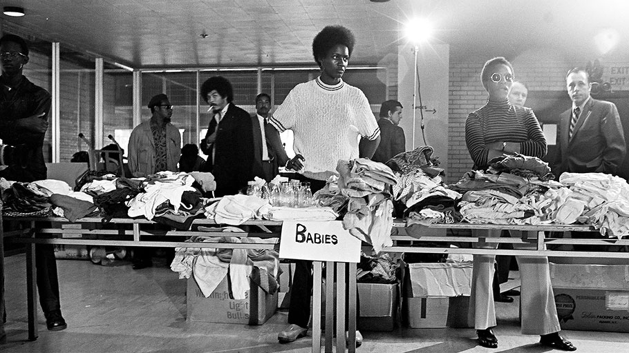 Members of the Black Panther party stand behind tables ready to distribute free clothing to the public in New Haven, Connecticut, 1969. Photograph: David Fenton/Getty Images