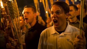 Peter Cvjetanovic along with neo-Nazis and white supremacists at the University of Virginia campus in Charlottesville, Virginia on \ in Charlottesville, Va. Photograph: Anadolu Agency/Getty Images