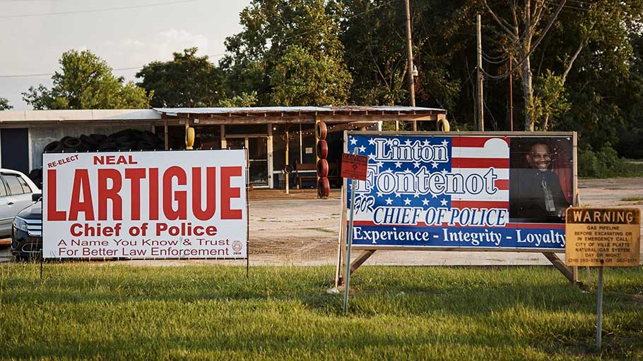 Campaign signs for the local police chief, Neal Lartigue, dot the streets of Ville Platte. Lartigue, who began as a patrol officer in 1991, was first elected chief in 2006.
