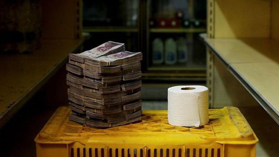 A toilet roll next to 2,600,000 bolivars, its price and the equivalent of US$0.40 at a mini-market in Caracas.