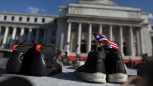 Activists put empty shoes outside the capitol building in San Juan, Puerto Rico, June 2018 to convey the toll of Hurricane Maria after a study estimated that the 2017 storm took thousands, not dozens, of lives.