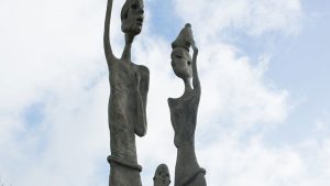 A bronze sculpture representing an African couple and their child in Rock Hall Freedom Village in Barbados