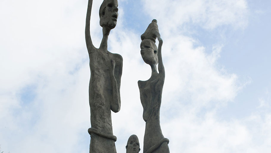 A bronze sculpture representing an African couple and their child in Rock Hall Freedom Village in Barbados