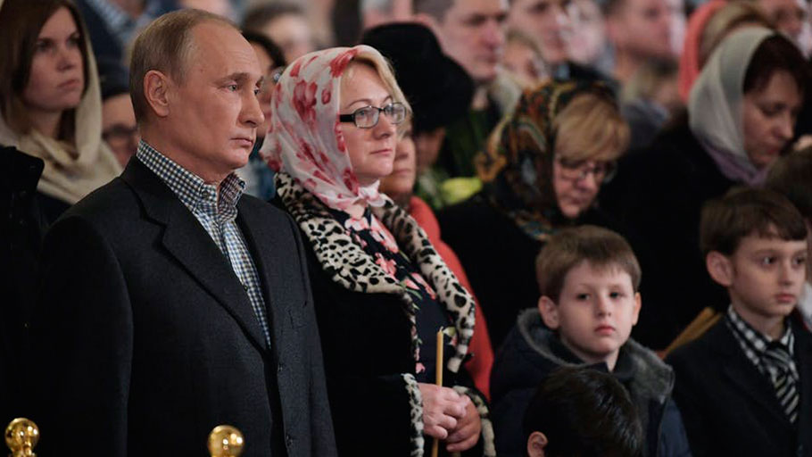 Russian President Vladimir Putin attends a mass in his hometown of St. Petersburg, Russia, on Jan. 7, 2018