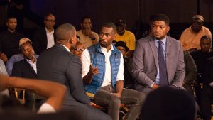 Carlos Watson sits with civil rights activist DeRay Mckesson and professor and journalist D. Watkins for Take On America in Baltimore on Oct. 8, 2018.