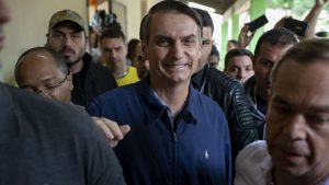 Brazil's right-wing presidential candidate Jair Bolsonaro leaves after casting his vote during the general elections in Rio de Janeiro, Brazil, on October 7, 2018.