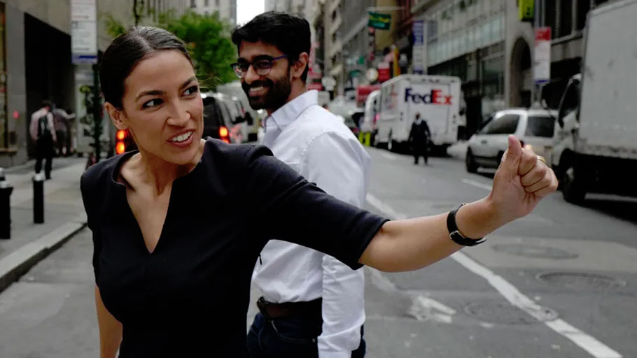 Alexandria Ocasio-Cortez reacts to a passerby in New York City on June 27, 2018.