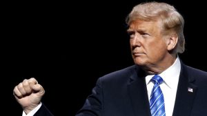 Donald Trump acknowledges the crowd after an address to the Veterans of Foreign Wars in Kansas City, Missouri.